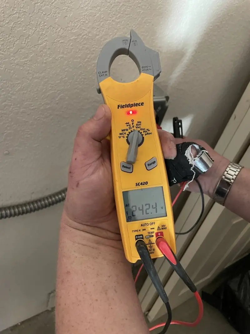 Voltage testing with clamp meter during Electrical Installation Services in Hannibal